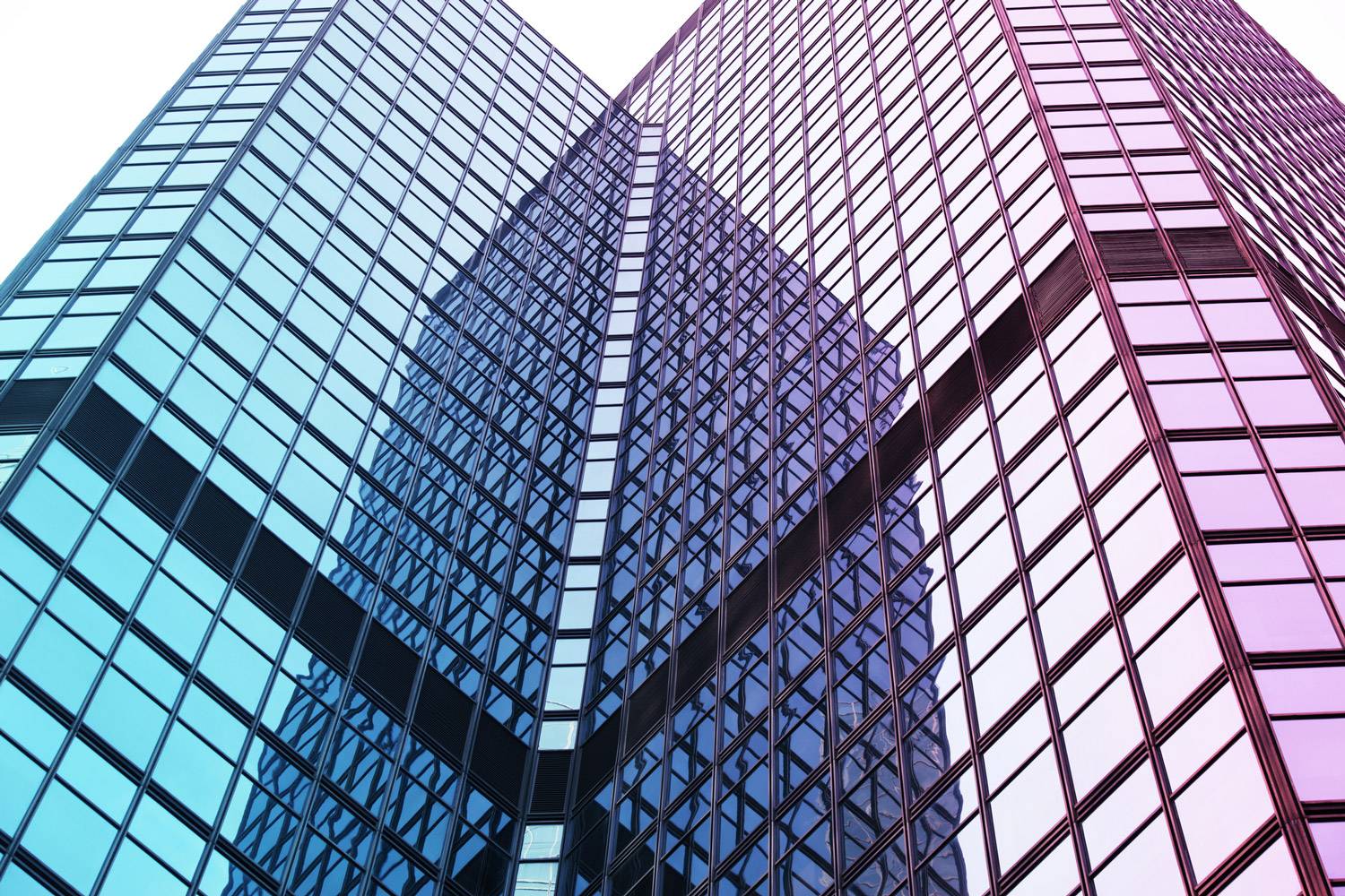 ground view looking up at skyscraper office building