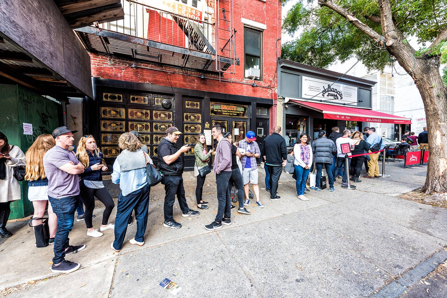 patrons waiting in line at restaurant