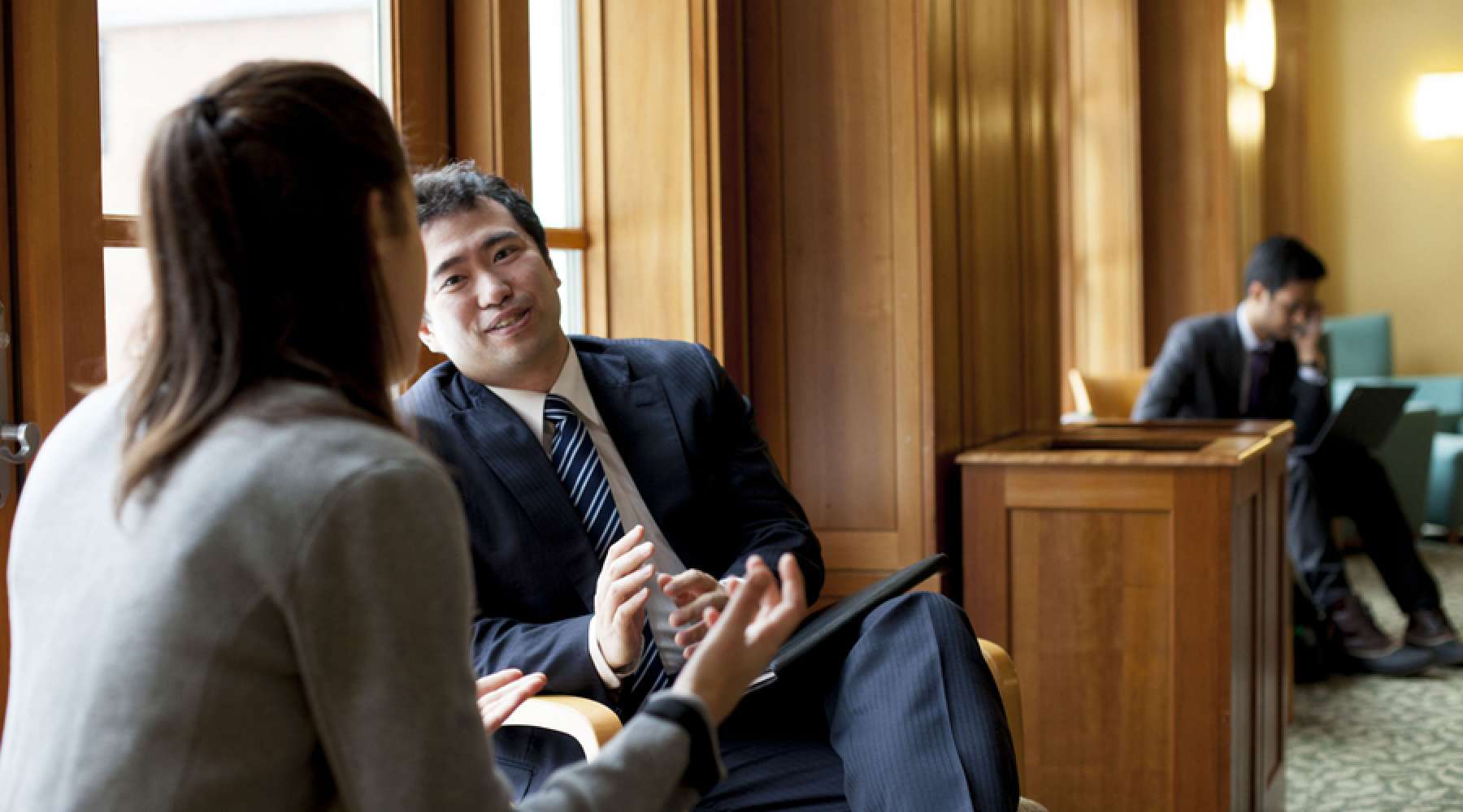 Two students speaking before an interview