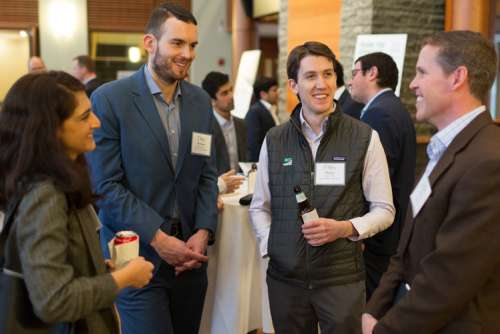 Students speaking with a visiting speaker