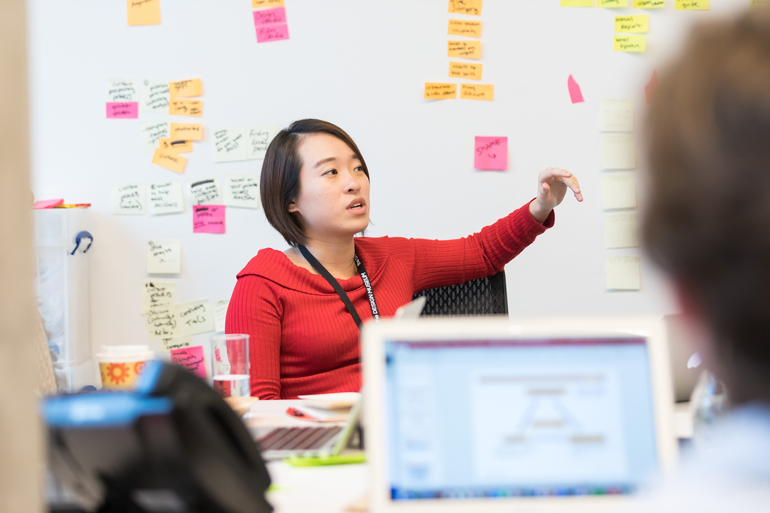 Tuck students strategize with whiteboard brainstorming at The Design Museum